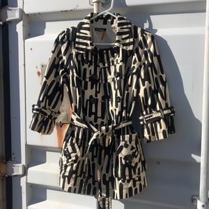 Beautiful three-quarter length sleeve jacket with belt and buttons